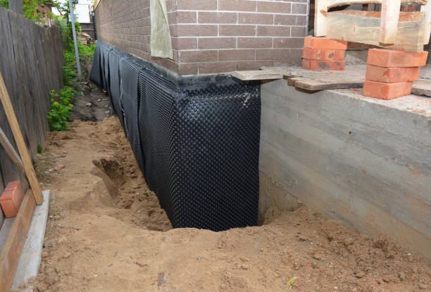 Happy homeowners after waterproofing job in Oakhurst